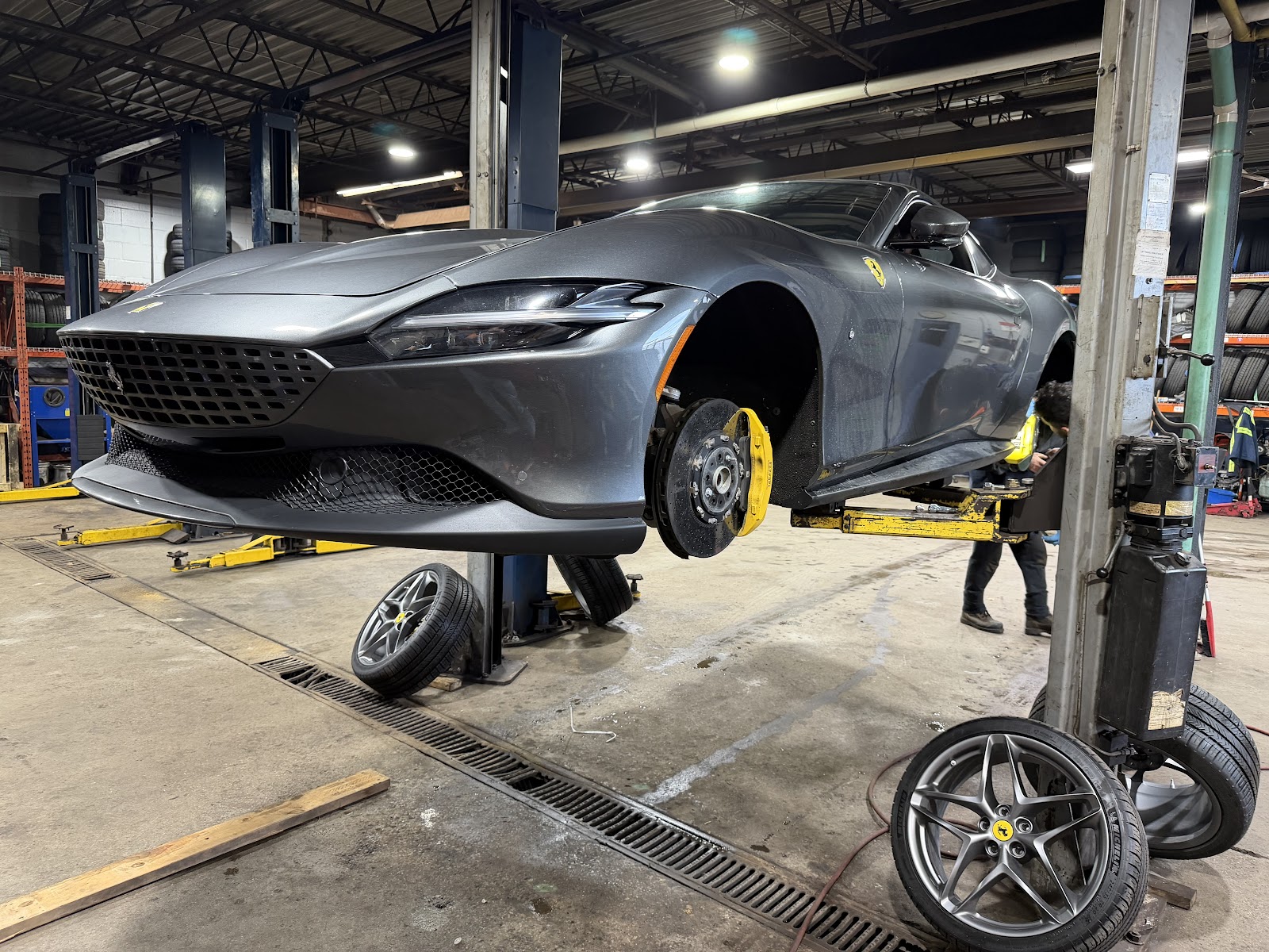 Car on a two-post lift, wheels off